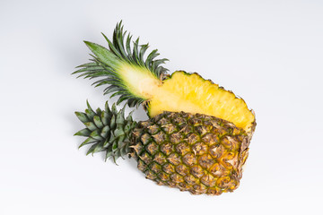 Whole fresh pineapple fruit on white background