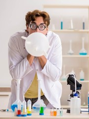 Funny crazy chemist doing experiments and tests