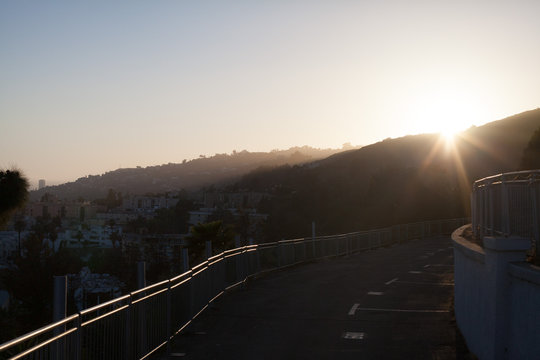 Empty Parking Lot Against Mountains During Sunset