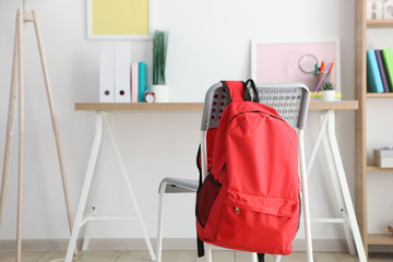 school backpack and stationery in a bright room. Preparing for school. Back to school. Place for text. National School Backpack Awareness Day - Powered by Adobe