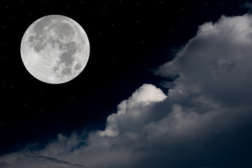 Fototapeta na wymiar Full moon and big clouds in the night.