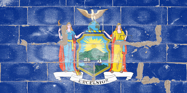 National flag of the US state of New York in the center of the coat of arms on a blue background on Independence Day painted graffiti on an old brick wall. Political and religious disputes, delivery.