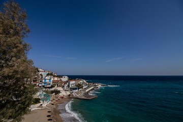 Armenistis, Ikaria, North Aegean Islands, Greece, beautiful picture-perfect traditional Greek fishing village with typical white washed houses and turquoise blue sea