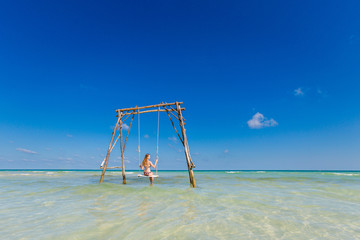 Young woman on swing Phu Quoc