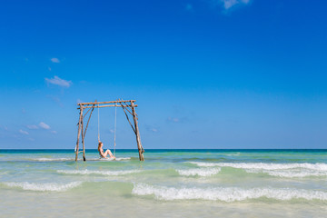 Young woman on swing Phu Quoc