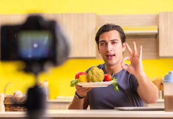 Young man blogging about food supplements