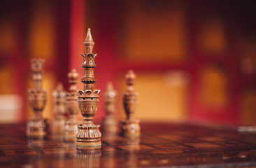 Handmade wooden chess on a lacquer board