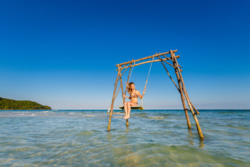 Young woman on swing Phu Quoc