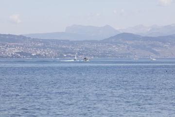 Sports boats on the leman lake with Lausanne in the background