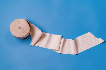 Roll of toilet paper on a blue background