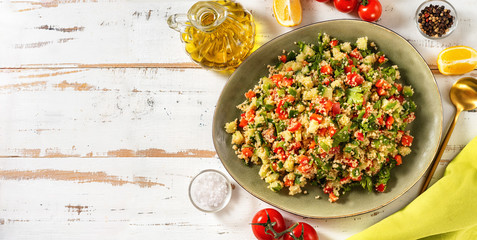 Top view of fresh summer vegan couscous salad with vegetables