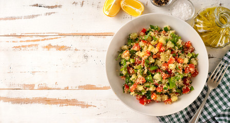 Fresh summer vegan couscous salad with vegetales captured from above