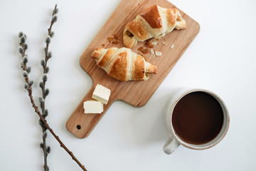 Homemade croissants on the table with a cup of cocoa. view from above - 352601403