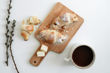 Homemade croissants on the table with a cup of cocoa. view from above - 352601460