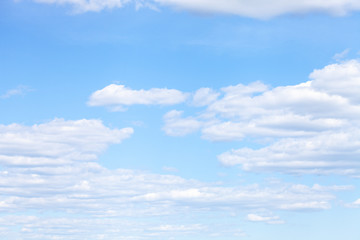 summer blue sky with white fluffy clouds.