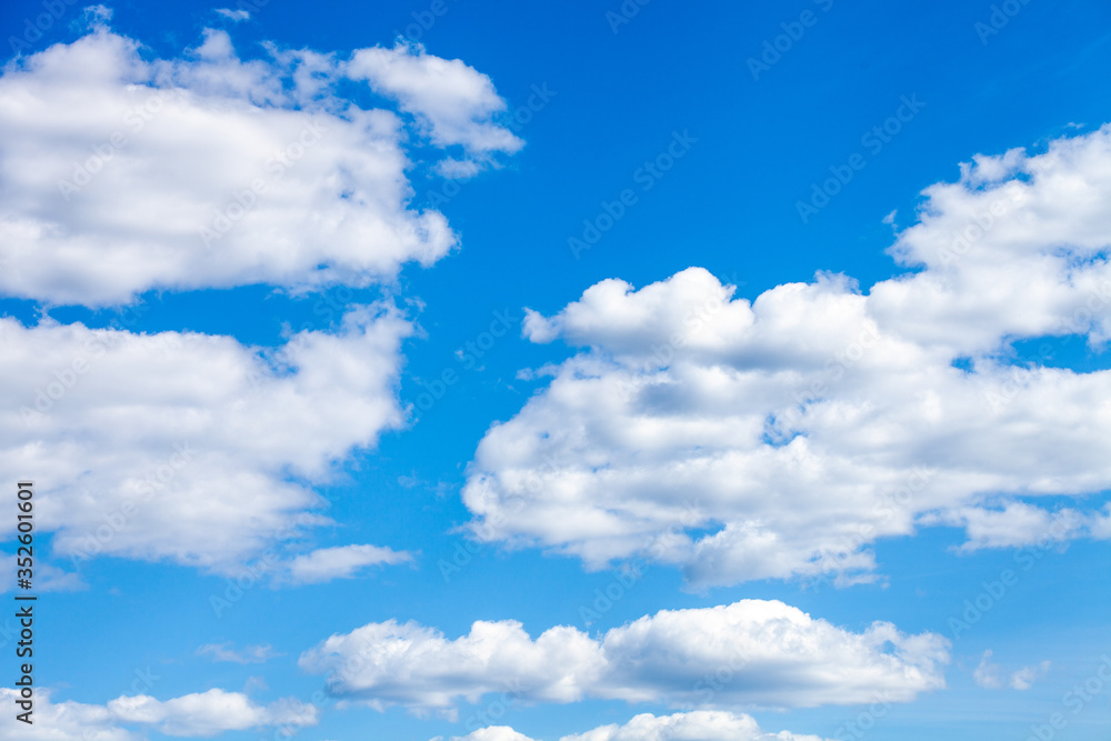 Poster summer blue sky with white fluffy clouds.