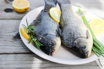Fresh fish carp on a plate