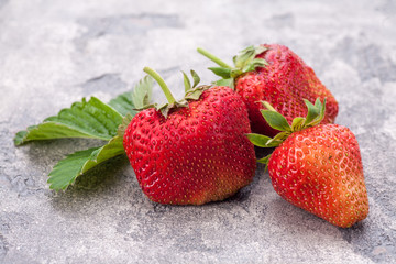 Strawberries on blue stone background, Fresh berries.