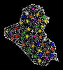 Web mesh vector map of Iraq with glare effect on a black background. Abstract lines, light spots and small circles form map of Iraq constellation.