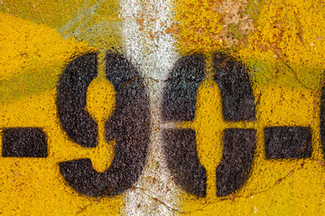 number 90 on a stone  wall