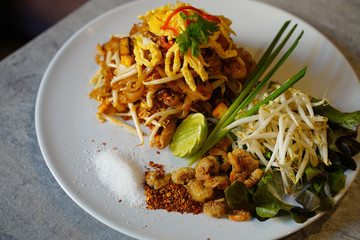 Pad Thai, Thai Style Fried Noodles with lemon, shrimp, nuts and bean sprouts