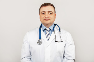 Portrait of smiling young male doctor with a stethoscope around the neck