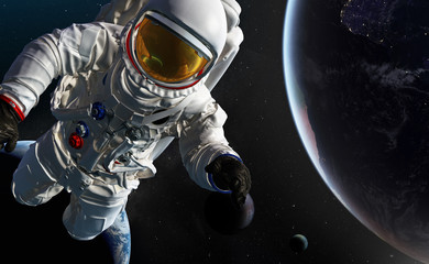 Fototapeta na wymiar Astronaut at spacewalk. Concept of conquering the universe by the human race. Elements of this image furnished by NASA