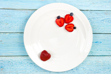Fresh ripe berry in closeup on isolated white background. Berries