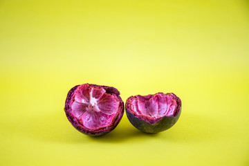 Ripe mangosteen in yellow background