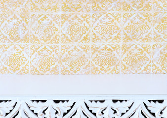 background Image of vintage table in front of white and gold oriental decorative wall. ready for product display
