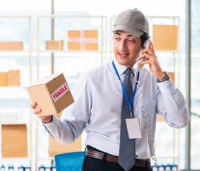 Male employee working in box delivery relocation service