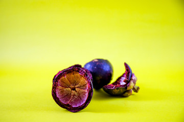 Ripe mangosteen in yellow background