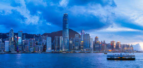 HONG KONG, CHINA - July 4, 2014: Coming twilight between the skyscrapers of Victoria Peak, Hong Kong on July 4, 2014