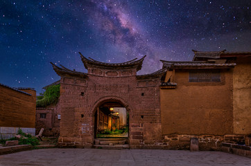 Shaxi China, the eastern gate in the old city, made of mud bricks, under the Milky Way