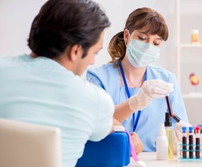 Young patient during blood test sampling procedure