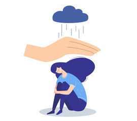 Sad depressed girl suffering from emotional problems protected by hand of help from a rain of negative thoughts.