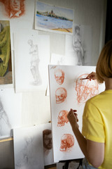 Attractive Woman drawing skull with headphones