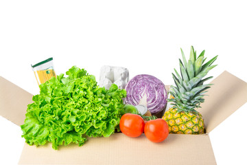 A carton box with products, vegetables, food isolated on a white. Delivery service. 