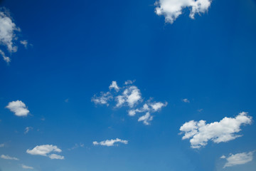 Blue sky in bright sunny weather with few clouds. Use for the background.