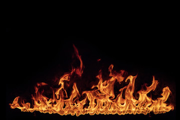 fire flames with sparks on a black background, close-up