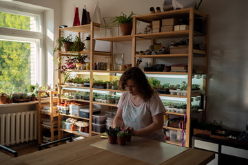 Girl Choose plant for FLorarium