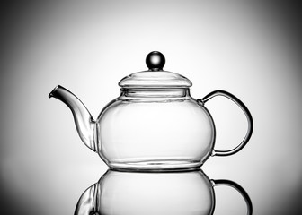 Glass teapot isolated on white background, closeup