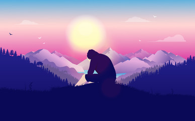 Man crying alone in landscape - Young male in hoodie sitting on hilltop with hands to his face. Beautiful landscape and view with sun in background. Unhappiness, feeling lost and outcast concept.