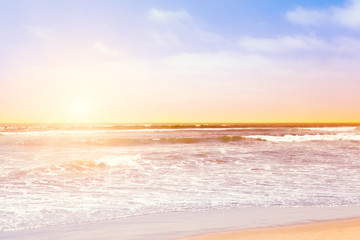 Pacific ocean waves at sunset