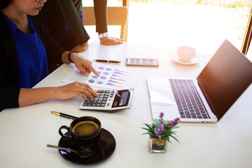 team Business analysts make decisions about the US economy that affect future operations of the company.concept