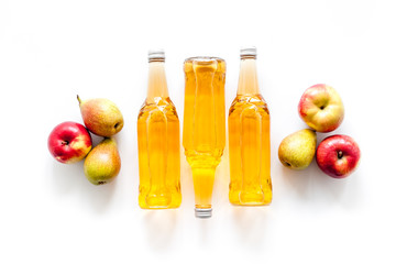 Set of beer bottles with apple, pears, wheat top-down