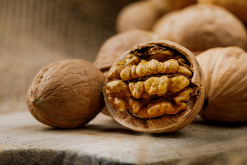 some cracked walnuts on cutting board