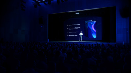 Live Event with Brand New Products Reveal: Keynote Speaker Presents Smartphone Device to Audience....