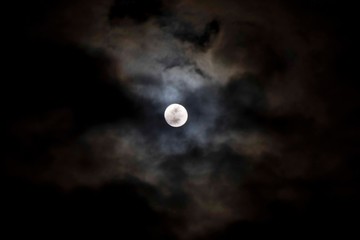 super moon in the night sky and clouds