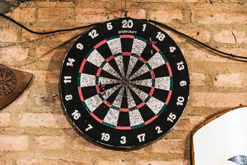 old style darts game in a wood wall